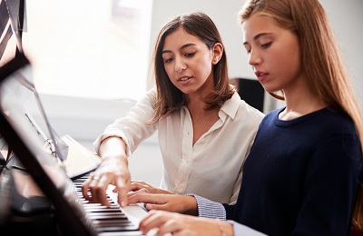 piano teacher and student